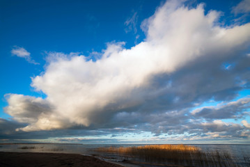 Clouds over the lake at sunset .