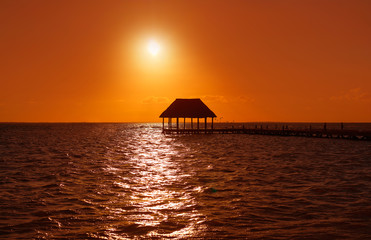 Holbox island sunset beach pier hut Mexico