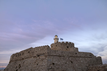 Fototapeta na wymiar fortress on the Mandraki harbour of Rhodes Greece