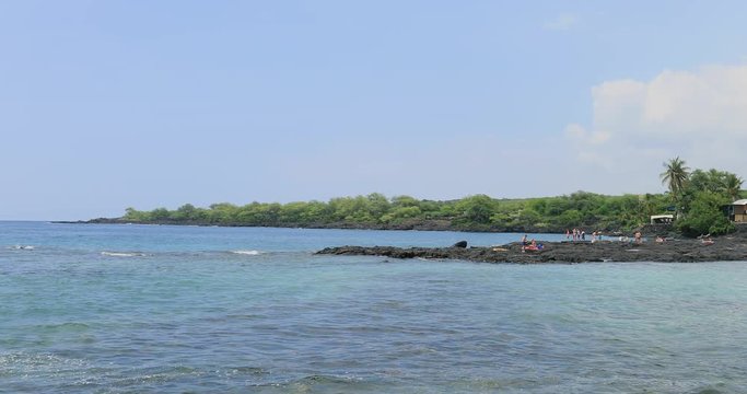 Tropical Two Step Beach underwater tourism. Destination swimming, scuba and snorkel, underwater fish and coral. Big Island, largest, most volcanic active. Economy is tourism based. Water and tropical.