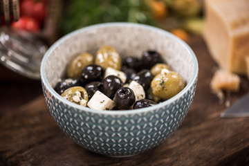 Olives and feta salad in bowl,spanish tapa bar food