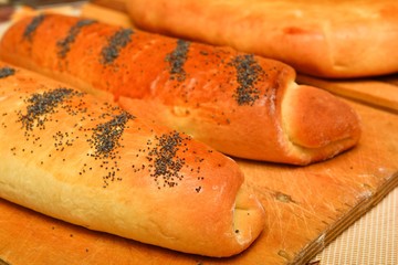 Homemade baking rolls on wooden background