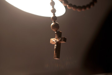 The wooden rosary in the light