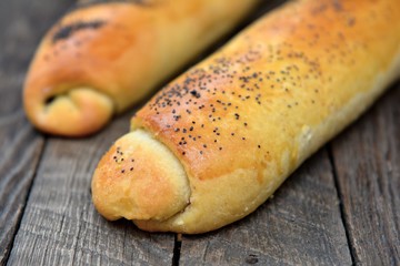 Homemade baking rolls on wooden background