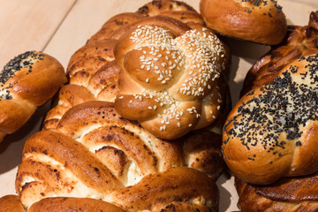 Different bakery products on a wooden background