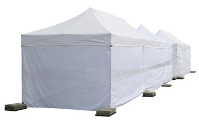 White canvas no name tents  is installed on the street.