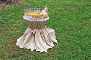 A small round table for a friendly party on the lawn.