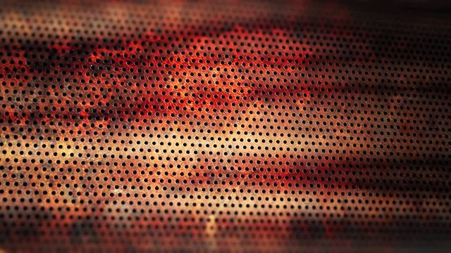 Rusty perforated sheet slowly rolling. 4K UHD animated loop video background.