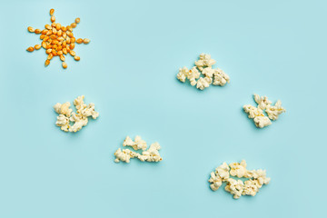 Obraz na płótnie Canvas Sun and clouds made of popcorn