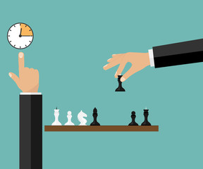 Game of chess. The hand rearranges the chess piece.