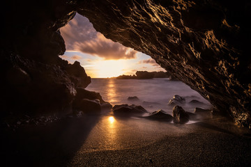 Lava tunnel at sea at sunset, maui island cave, hawaii, usa