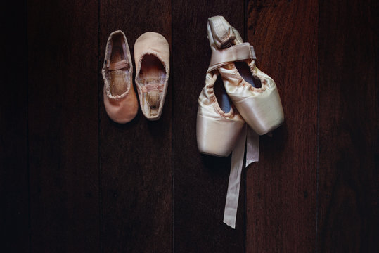 Comparison between a girl's first ballet shoes as a child and her first pointe shoes now