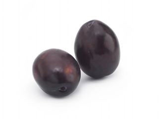 Plums on white background