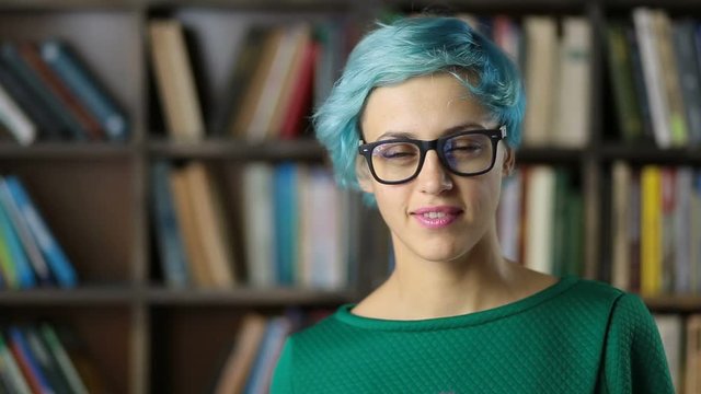 Portrait of smiling hipster girl in eyeglasses