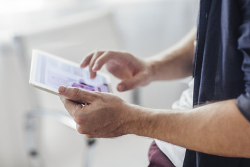 Man Holding Tablet