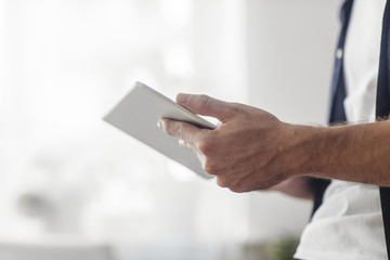 Man Holding Tablet