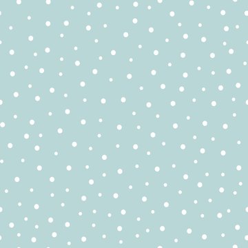 Seamless snow pattern on a blue background. Falling snow on blue. Vector seamless background.
