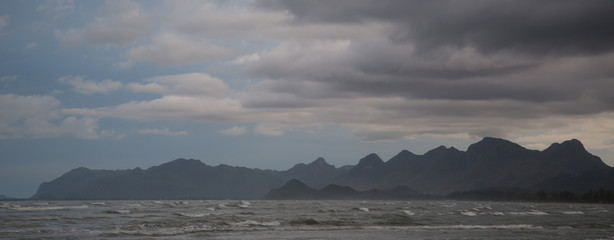 Exotic Koh Lanta Beach, Krabi Province, Thailand. Sea and rocks in cloudy day. Panorama