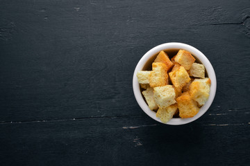 Salt toast of bread. On a wooden background. Top view. Free space for your text.