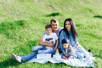 happy family rest in nature and eat cake