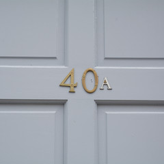 House number 40A sign on blue wooden door
