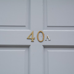 House number 40A sign on blue wooden door
