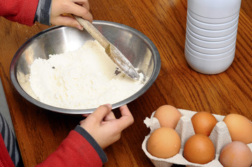 Child cooking pancake