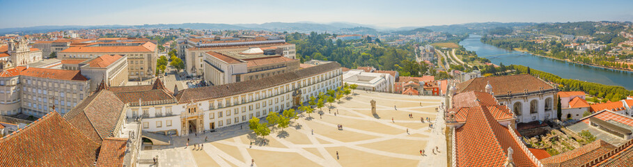 Coimbra panorama from top of bell clock tower. Coimbra city skyline and University courtyard on...