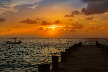 Riviera Maya pier sunrise in Caribbean Mayan