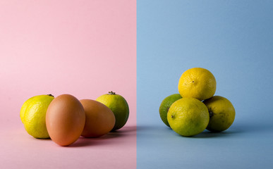 Isolated eggs and lemon concept over a creative modern background.