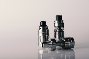 isolated vape tanks for electronic cigarette or e cig over a white background. vaping heads.
