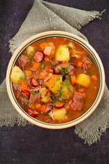 Tasty stew. Goulash soup bograch in a bowl. Hungarian dish, view from above, top shot, vertical