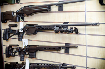 Gun wall rack with rifles