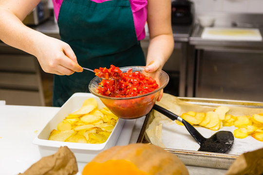 Preparing Tomatoes and Potatoes in a Professional Kitchen