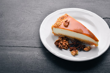 Nutcake. On a wooden background. Top view. Free space for your text.