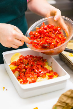 Preparing Tomatoes and Potatoes in a Professional Kitchen