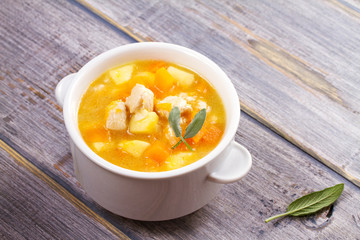 Chicken, butternut, apple ginger and sage stew. Pumpkin and chicken breast soup, horizontal
