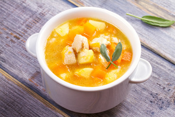 Chicken, butternut, apple ginger and sage stew. Pumpkin and chicken breast soup, horizontal