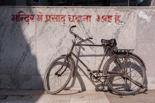 old bicycle at temple marble wall