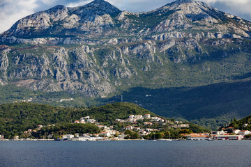 Obraz premium Condos on Coast Below Montenegro Mountains
