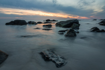 Scenic seascape with sunset over the Lofoten islands in Norway. Long exposure.