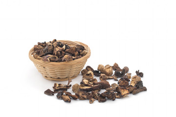 Basket of dried mushrooms isolated on white background