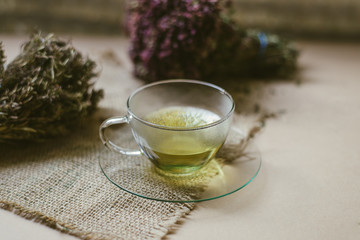 Herbal tea in glass teacup