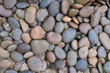 Stone texture background, River stone floor materials for path in the garden. Walkway design with stones
