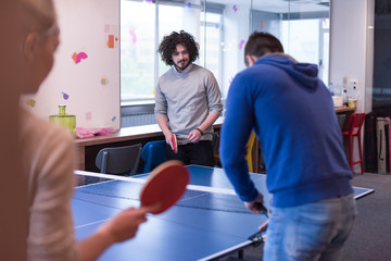 startup business team playing ping pong tennis