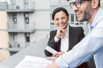 Happy smiling real estate agent doing her job