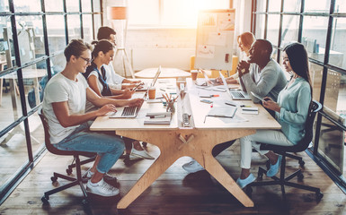 Young people work in modern office