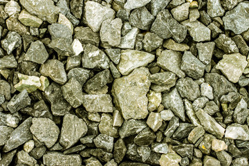 Stone wall texture background, pattern natural color of modern style design decorative uneven cracked real stone wall surface with cement