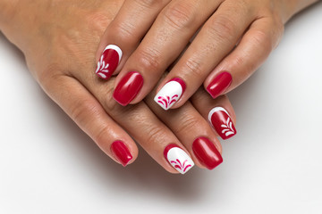 red and white manicure with monograms on square long nails
