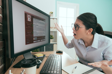 unhappy business manager looking at computer